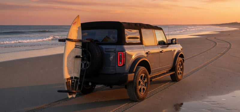 SUV at the beach at golden hour with surfboard on RadRack